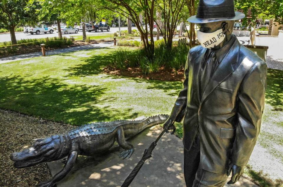 The Charles Fraser statue in Compass Rose Park on Hilton Head Island has now acquired a Hilton Head Island face mask as seen on Thursday, April 16, 2020 for personal protection against the coronavirus. While the individual that protected the founder of Hilton Head is unknown, it stopped the few walking or biking past the closed park to take a picture.