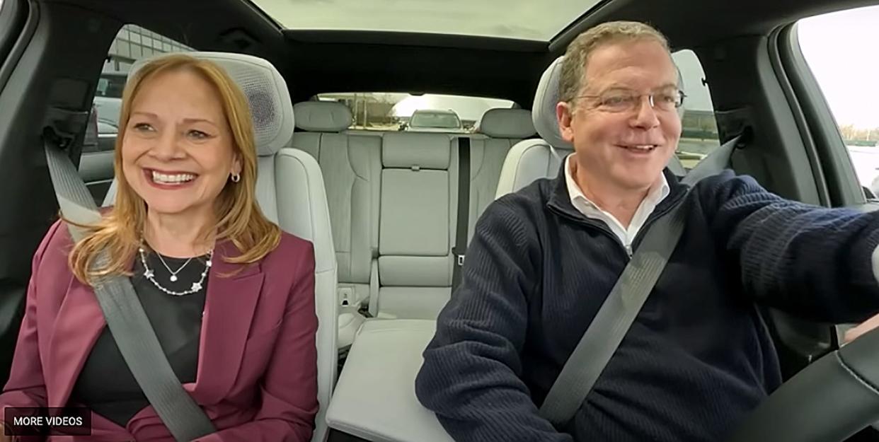 In this frame grab from video, GM CEO Mary Barra, left talks with Stephen Scherr, Hertz CEO as they drive around Detroit in a new Cadillac Lyriq. General Motors wants to get consumers in its electric vehicles via rental car company Hertz and CEO Mary Barra is touting the plan in a new video with Hertz CEO Stephen Scheer.
