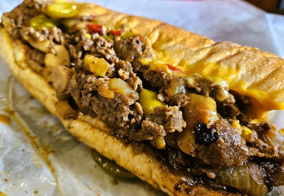 A cheesesteak with onions, mushrooms, hot peppers, sweet peppers and Cheez Whiz at Gentile’s Cheesesteaks, 7523 S Tamiami Trail, Sarasota, photographed Oct. 7, 2023.