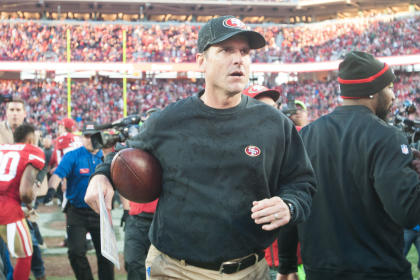 Jim Harbaugh got a game ball in his final game as Niners coach. (USA TODAY Sports) 