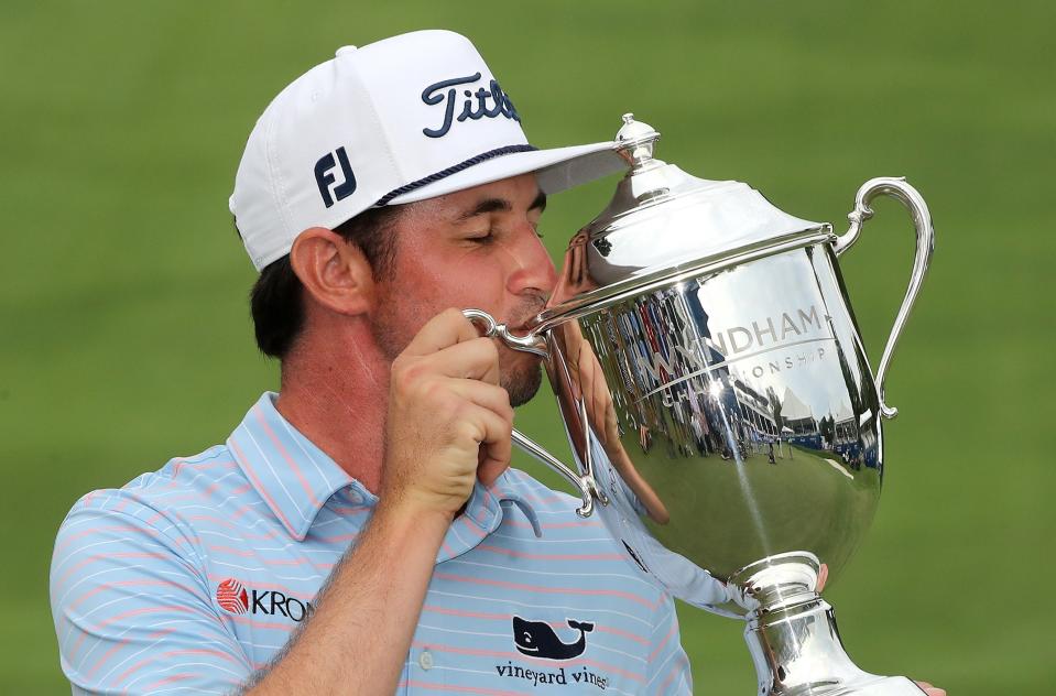 J.T. Poston, proud grandson of Pa Doc, kisses the Sam Snead Cup presented to him as the winner of the Wyndham Championship. (Photo by Streeter Lecka/Getty Images)