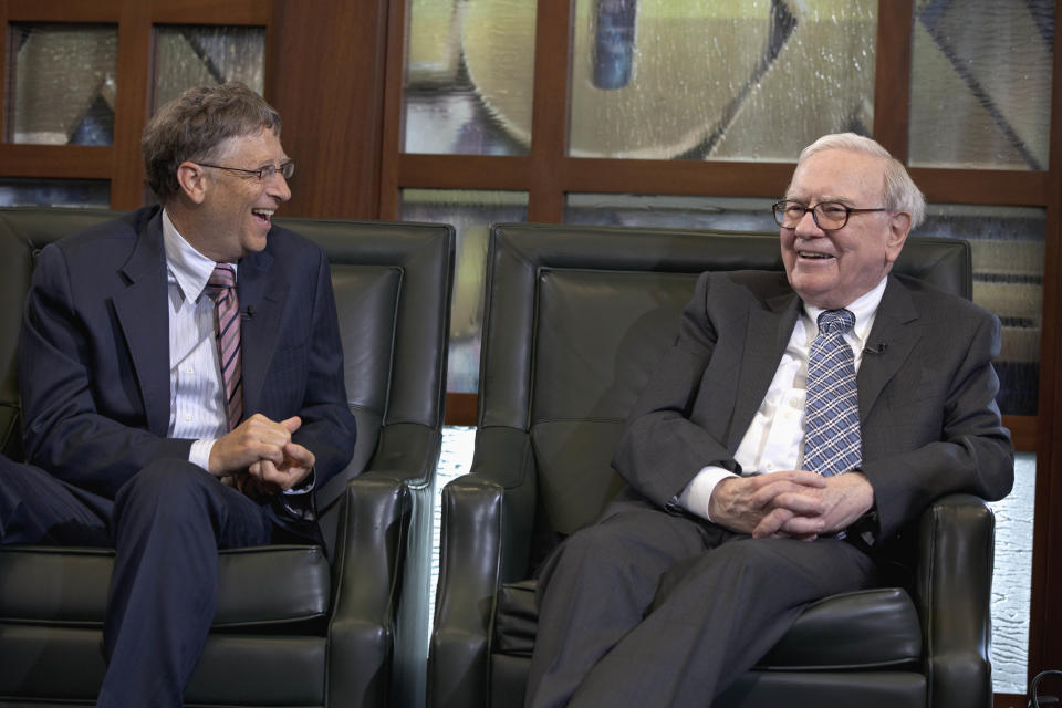 Warren Buffett, chairman and CEO of Berkshire Hathaway, right, looks at Microsoft founder and Berkshire board member Bill Gates during an interview with Liz Claman of the Fox Business Network in Omaha, Neb., Monday, May 7, 2012. Buffett said on Monday that Europe will have a hard time resolving its fiscal problems because of the structure of the European Union and this weekend's election results in Greece and France, but he says the turmoil in Europe won't keep him from investing. Buffett said Berkshire plans to buy two U.S. stocks Monday that it already holds to add to its stakes in those companies. (AP Photo/Nati Harnik)