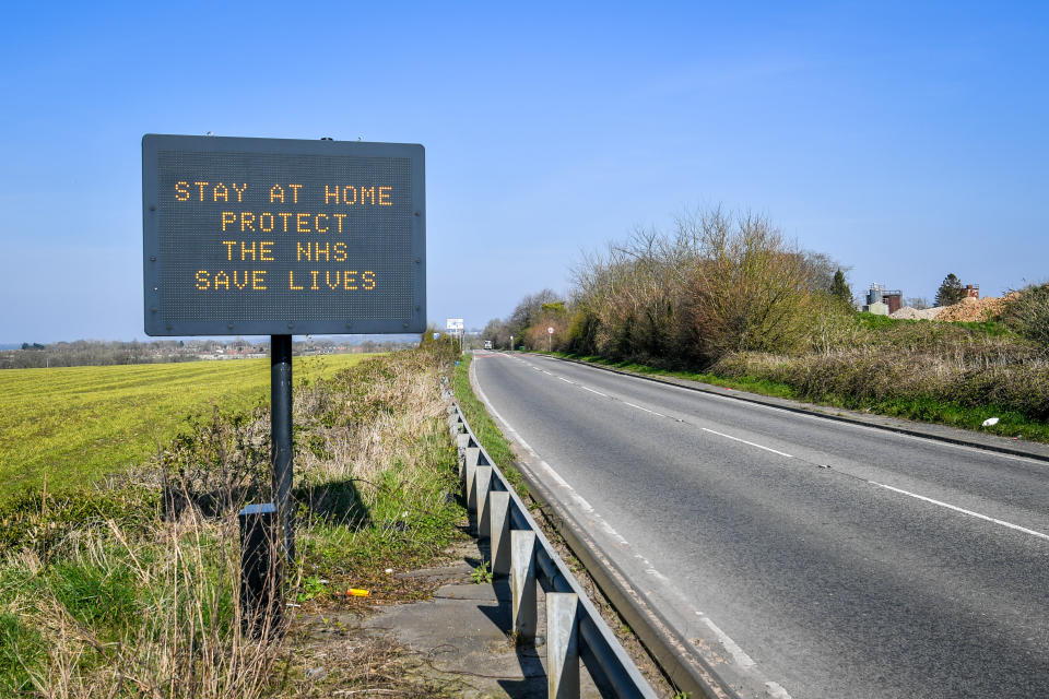 A matrix road sign on the A367 into Bath advises motorists to stay at home to protect the NHS and save lives the day after Prime Minister Boris Johnson put the UK in lockdown to help curb the spread of the coronavirus. (Photo by Ben Birchall/PA Images via Getty Images)