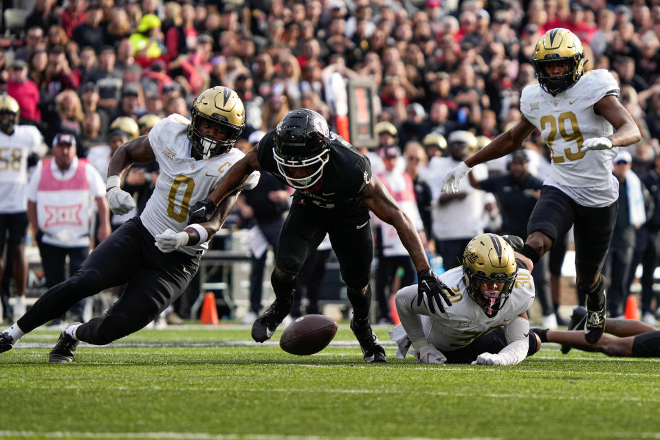 UC's wide receiver Xzavier Henderson (8) attempts to regain control of the ball during the UC vs. UCF game at Nippert Stadium on Saturday November 4, 2023.