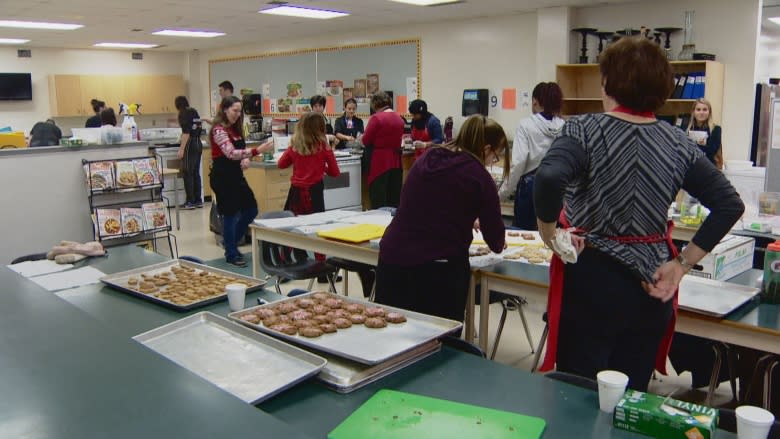 M.E. LaZerte High School students whip up 3,000 cookies for women in need