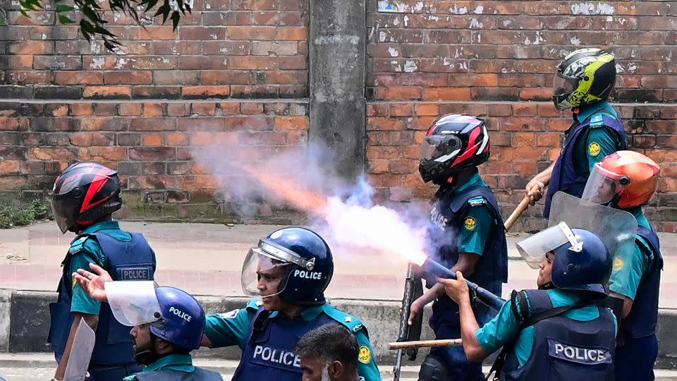 Bangladeshi police fire tear gas to disperse protesters during a clash in Dhaka on July 18, 2024. - Munir Uz Zaman/AFP/Getty Images