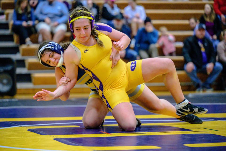 Battle's Rafaella Cedeno works Hickman's Lyla Eversole to mat on January 3, 2022, at Hickman High School.