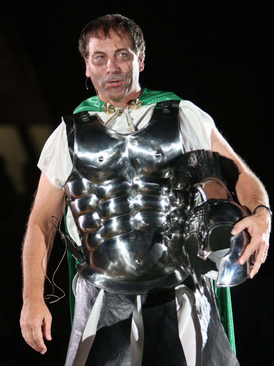 Michigan State basketball coach Tom Izzo talks to the crowd during Midnight Madness festivities, Friday, Oct. 12, 2007, in East Lansing, Mich. The event used "300" movie-themed costumes.