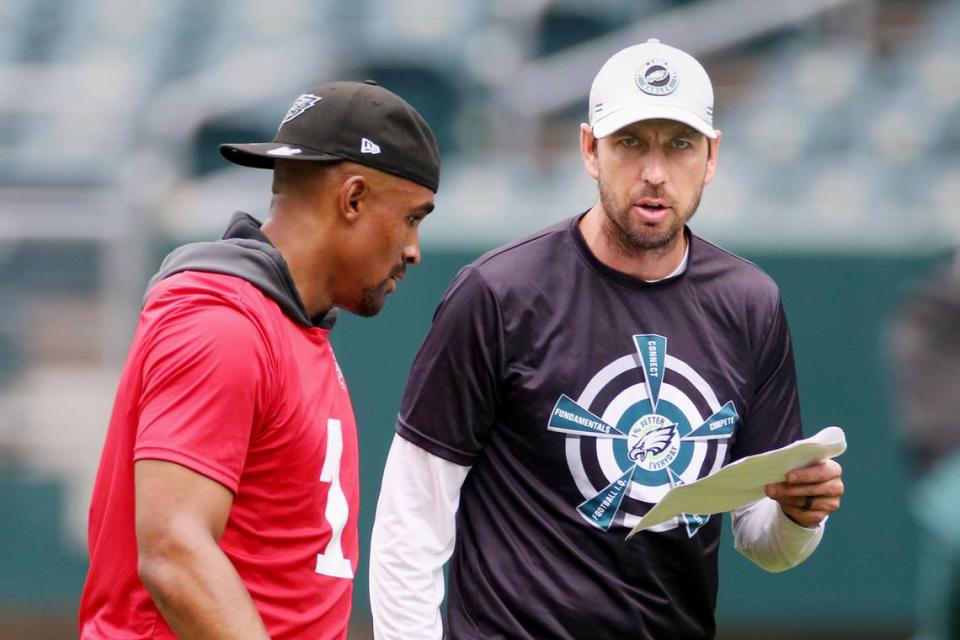 Philadelphia Eagles quarterback Jalen Hurts, left, stands with offensive coordinator Shane Steichen during NFL football practice at Lincoln Financial Field, Friday, June 4, 2021, in Philadelphia. (Tim Tai/The Philadelphia Inquirer via AP, Pool)