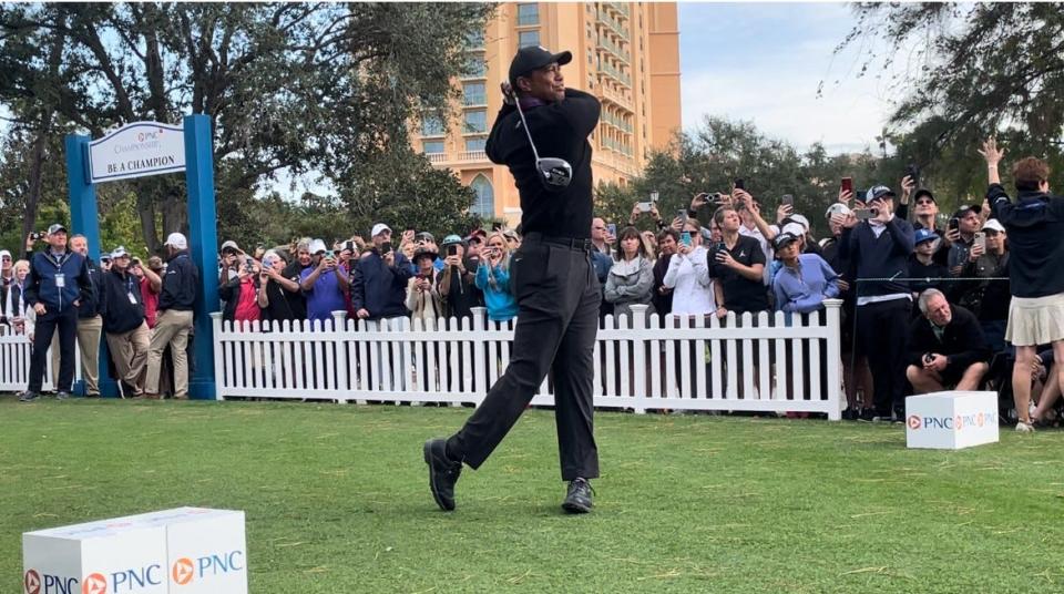 Tiger Woods hits his drive on the first tee during Friday's pro-am at the PNC Championship