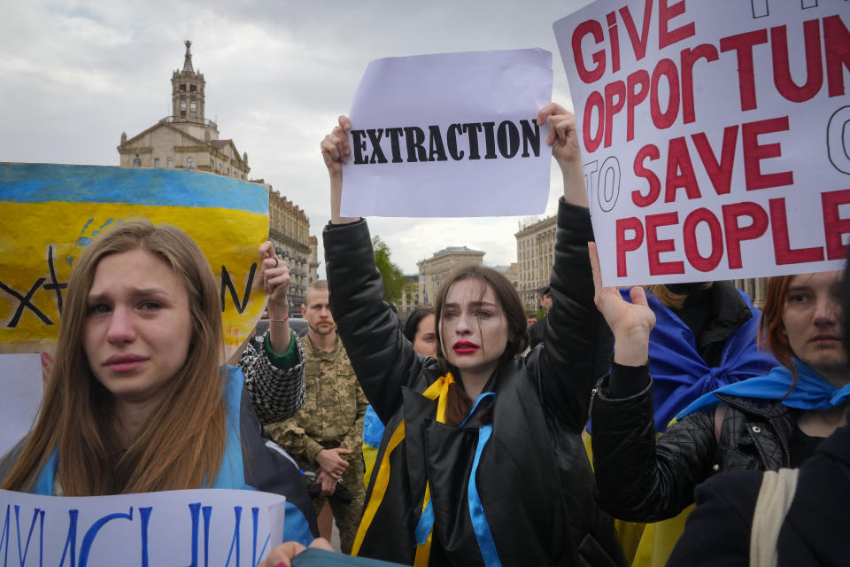 Wives, relatives and activists take part in a rally demanding international leaders to organize a humanitarian corridor for evacuation of Ukrainian military and civilians from Mariupol, amid Russia's invasion of Ukraine, in central Kyiv, Ukraine, Saturday, April 30, 2022. (AP Photo/Efrem Lukatsky)