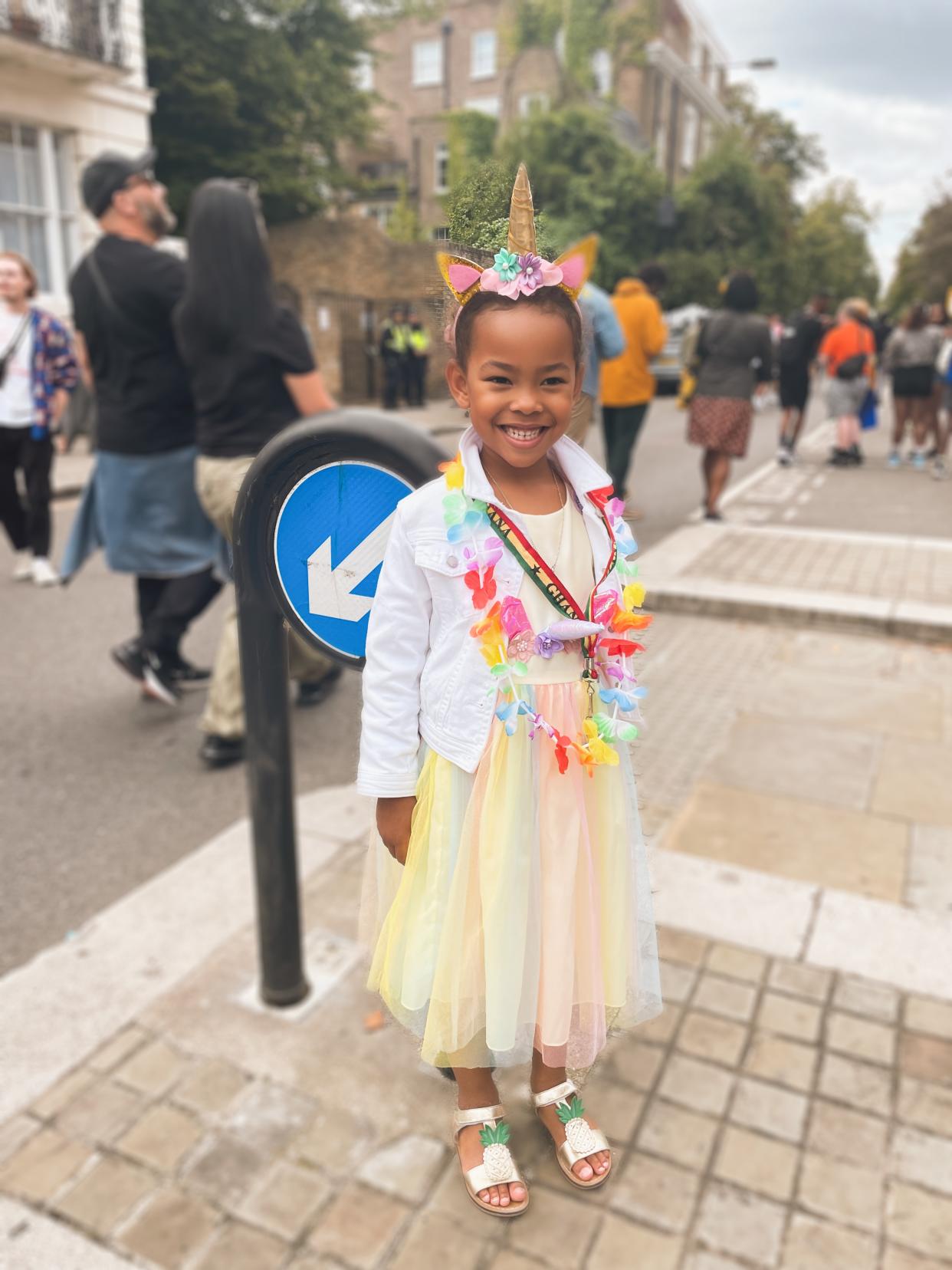 Little girl standing and looking at the camera 