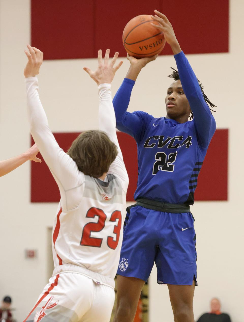 CVCA's Darryn Peterson shoots a 3-pointer with pressure from Northwest's Ethan Nickey in the first half at Northwest, Friday, Feb. 11, 2022.