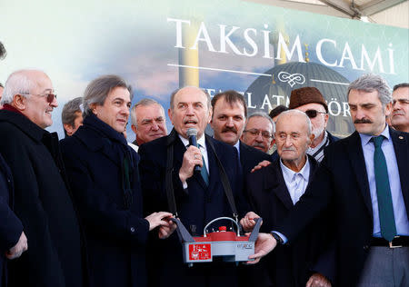 Istanbul's Mayor Kadir Topbas (C) delivers a speech during the groundbreaking ceremony of Taksim mosque in Istanbul, Turkey, February 17, 2017. REUTERS/Osman Orsal