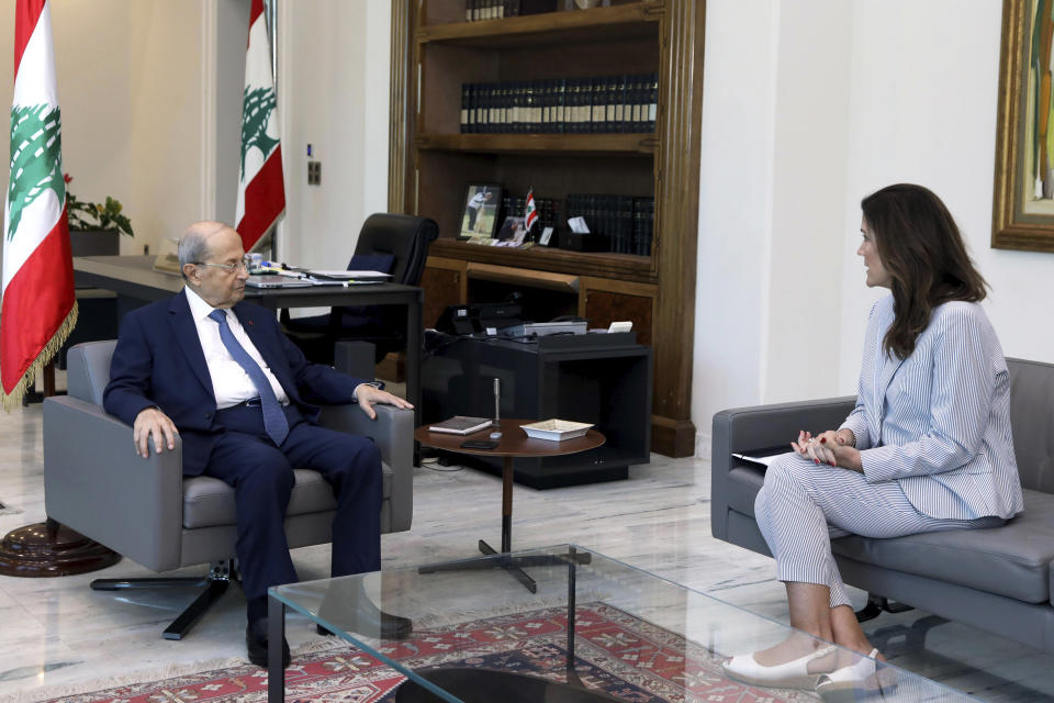 In this photo released by Lebanon's official government photographer Dalati Nohra, Lebanese president Michel Aoun, left, meets with U.S. Ambassador to Lebanon Dorothy Shea, at the Presidential Palace in Baabda, east of Beirut, Lebanon, Saturday, Oct. 1, 2022. Shea delivered a maritime border demarcation proposal to Lebanese President Michel Aoun on Saturday, as negotiations with Israel continue to progress. (Dalati Nohra via AP)