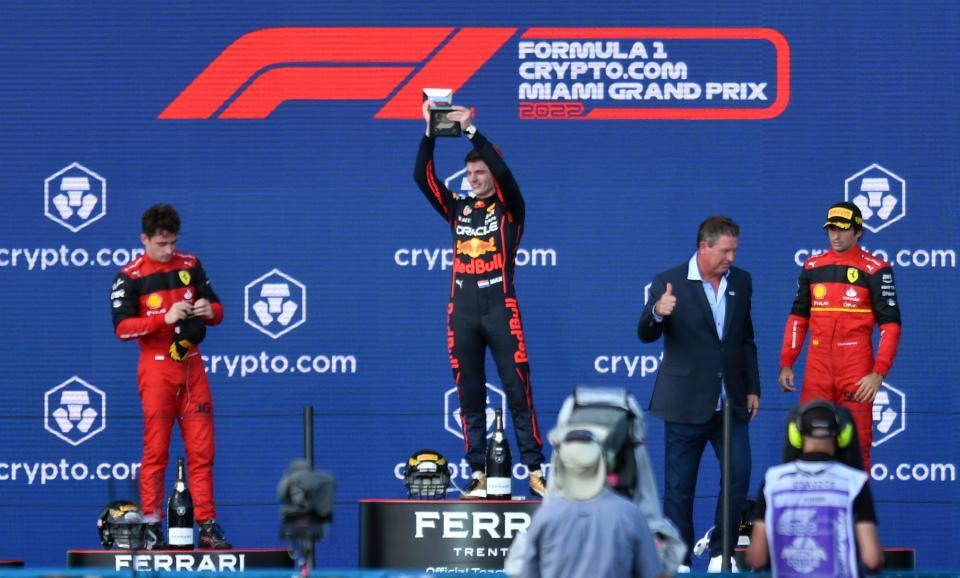 Dan Marino presents the trophy Sunday to winning driver Max Verstappen, center, of Red Bull. Second place went to Charles Leclerc of Ferrari, left, and third place went to Carlos Sainz of Ferrari at the Formula 1 Crypto.com Miami Grand Prix in Miami Gardens.