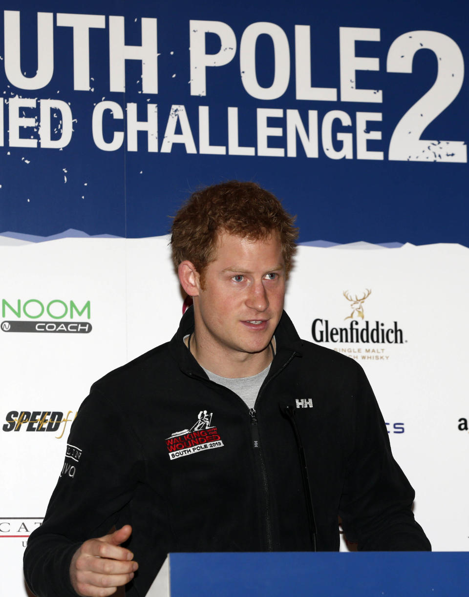 Britain's Prince Harry, the Expedition Patron, talks during a welcome home news conference for the members of the Walking With The Wounded South Pole Allied Challenge 2013 team, in central London, Tuesday, Jan. 21, 2014. The Walking With The Wounded Virgin Money South Pole Allied Challenge 2013 concluded on Friday 13 December, when three teams of wounded servicemen and women successfully reached the South Pole after crossing 200km of Antarctic plateau. (AP Photo/Lefteris Pitarakis, Pool)