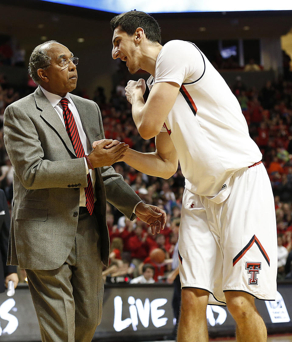 Texas Tech coach Tubby Smith, left, talks with Dejan Kravic during their NCAA college basketball game against Baylor in Lubbock, Texas, Wednesday, Jan, 15, 2014. (AP Photo/Lubbock Avalanche-Journal, Tori Eichberger) ALL LOCAL TV OUT