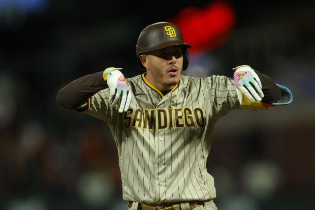 Manny Machado of the San Diego Padres celebrates after hitting an