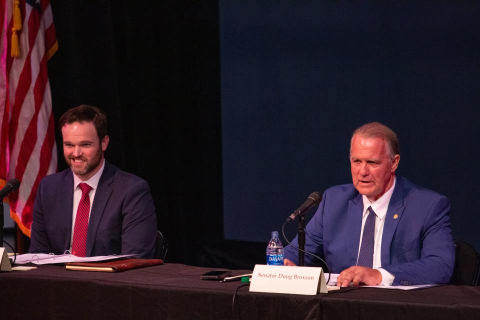 State Rep. Alex Andrade, R-Pensacola, left, and state Sen. Doug Broxson, R-Gulf Breeze, listen during the annual delegation meeting at Pensacola State College on Tuesday.