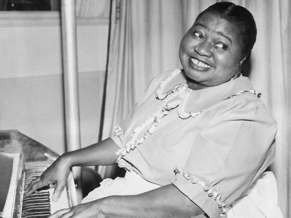 Hattie McDaniel playing the piano.