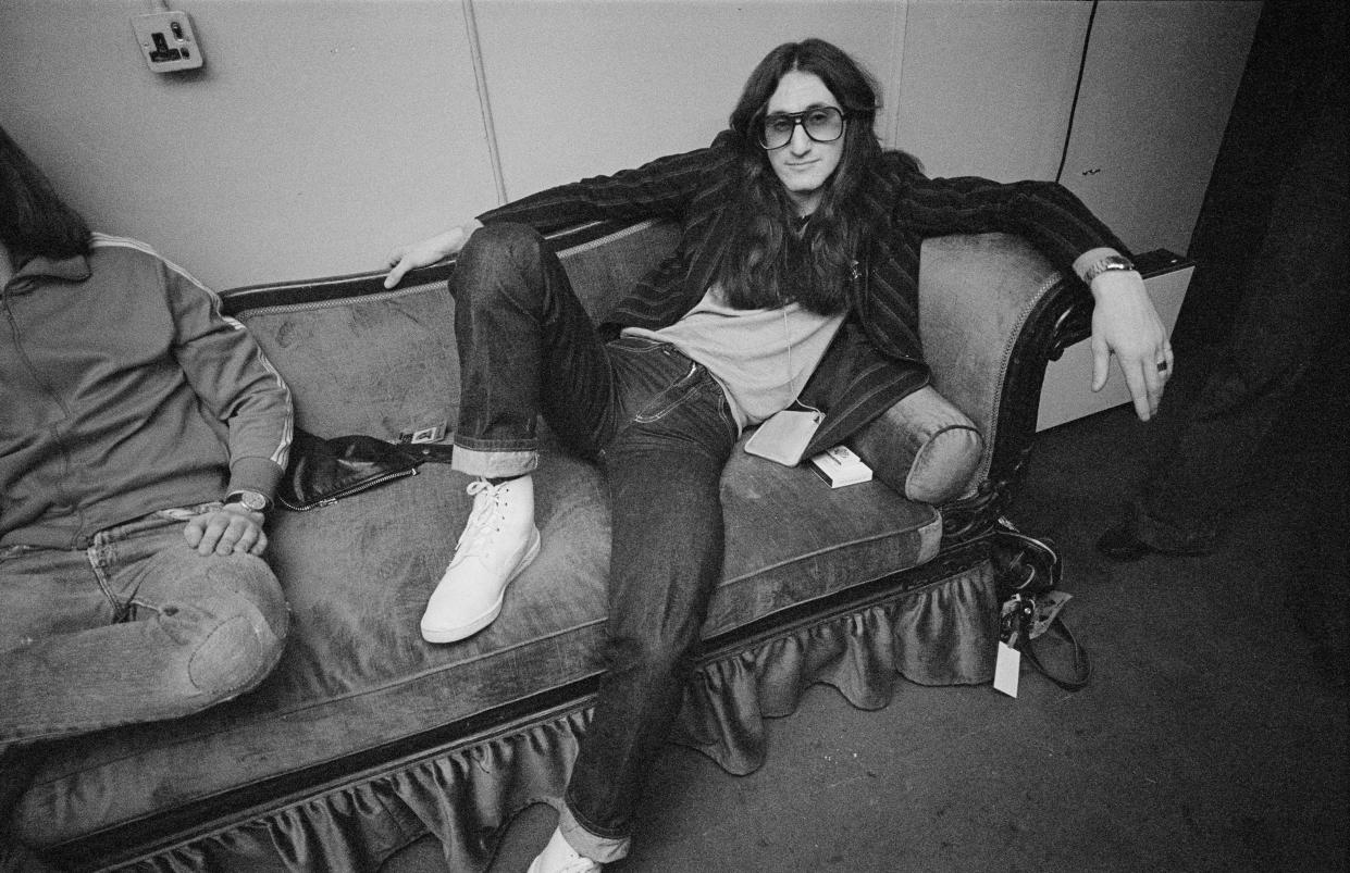 Singer and bassist Geddy Lee of Canadian progressive rock band, Rush, backstage at the Hammersmith Odeon, London, during the 'A Farewell To Kings' tour, 19th February 1978.