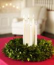 <p>This easy-to-make candle wreath is classic for the holidays.</p><p>See more at <a href="http://www.goodhousekeeping.com/holidays/christmas-ideas/how-to/g2203/christmas-decoration-ideas/?slide=6" rel="nofollow noopener" target="_blank" data-ylk="slk:Good Housekeeping;elm:context_link;itc:0;sec:content-canvas" class="link ">Good Housekeeping</a>. </p>