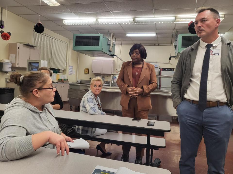 Renee Remart asks Terrebonne Superintendent Bubba Orgeron about his plans to increase certified teachers and close Honduras Elementary School, November 30, at the school.