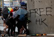 Anti-government demonstrators attend a protest march in Hong Kong