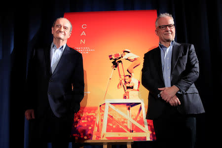 Cannes Film festival general delegate Thierry Fremaux and Cannes Film festival president Pierre Lescure pose next to the poster of the 72nd Cannes International Film Festival during a news conference to announce its official selection in Paris, France, April 18, 2019. REUTERS/Gonzalo Fuentes