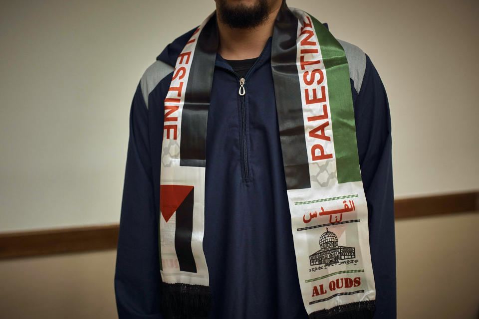 Muslim Rutgers University's student wears a Palestinian scarf on Friday, Oct. 27, 2023, in New Brunswick, N.J. For many of the university chaplains and faith leaders caring for students angered and shaken by the Israel-Hamas war, the needs are acute, the days intense. The bloodshed has roiled campuses in the United States, sparking rival rallies and competing demands.(AP Photo/Andres Kudacki)