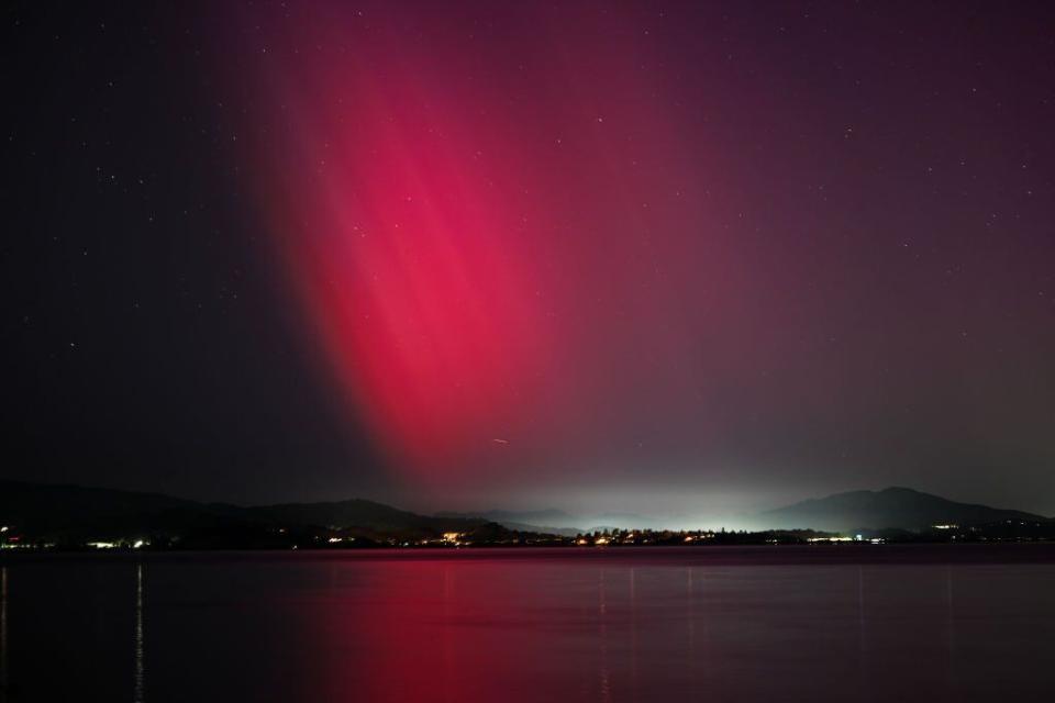 The Northern Lights (aurora borealis) illuminate the sky of San Francisco North Bay as seen from China Camp Beach in San Rafael, California.