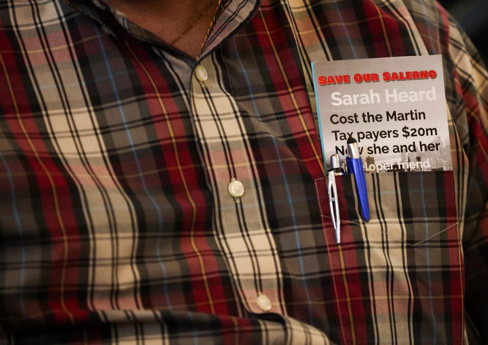A pamphlet made by the Save Our Salerno group, sits in the pocket of a man attending a town hall meeting with Martin County Commissioner Sarah Heard to discuss parking proposals and development in Port Salerno on Tuesday, Oct. 3, 2023, at the Port Salerno Civic Center, 4950 S.E. Anchor Ave. Many in attendance were part of the Save Our Salerno nonprofit and are opposed to real estate investor J. Corey Crowley's vision for Port Salerno.