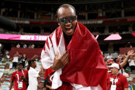 <p>Gold medalist Mutaz Essa Barshim of Team Qatar takes a victory lap around the track following the Men's High Jump Final at Olympic Stadium on August 1.</p>