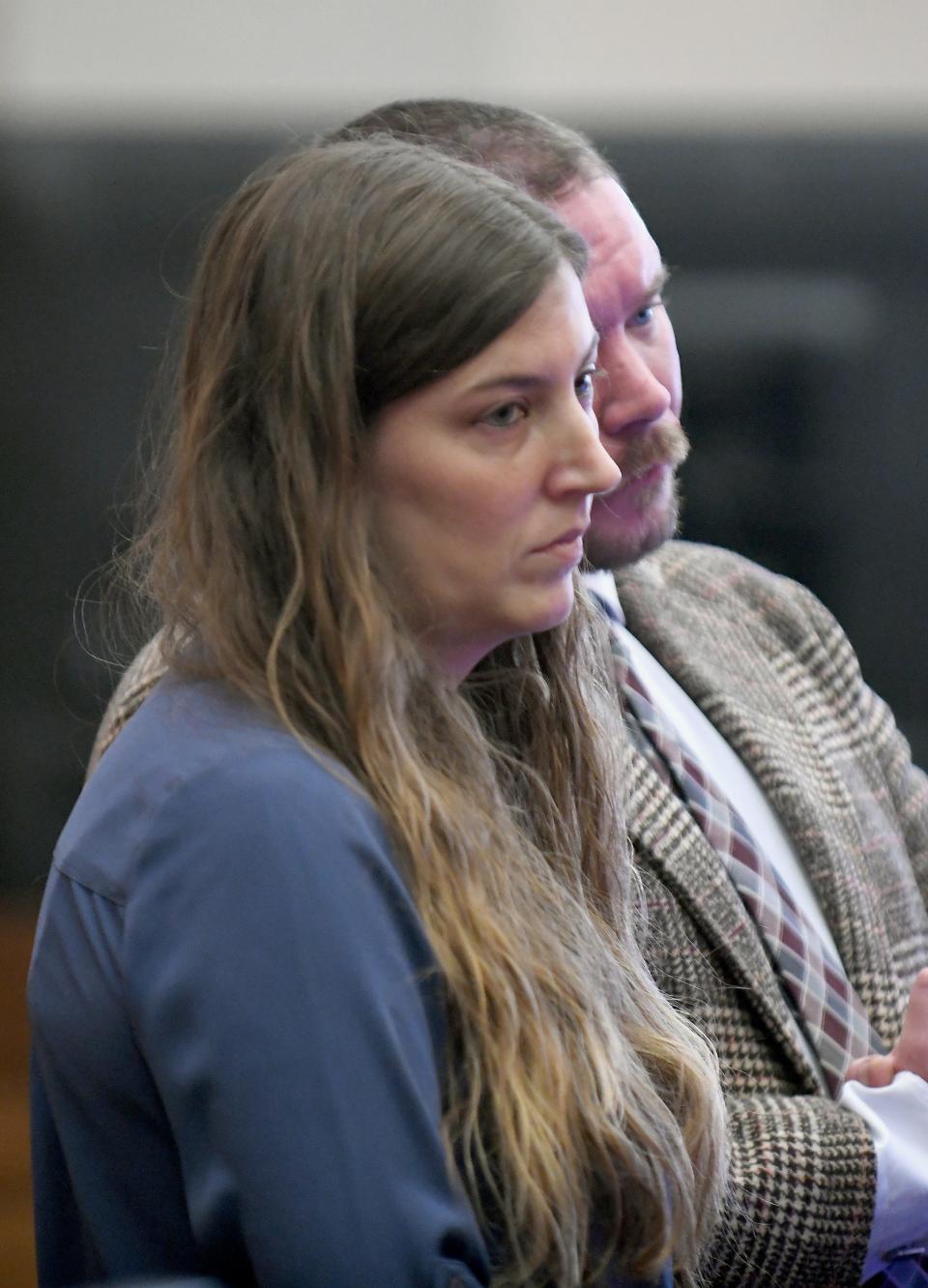 Lindsey Abbuhl, with defense attorney Paul Kelley listens as her former friend Katie Marskell addresses her after sentencing on felony endangering children and felony theft during an appearance in the Stark County Courtroom of Judge Chryssa Hartnett.  Thursday,  November 17, 2022.