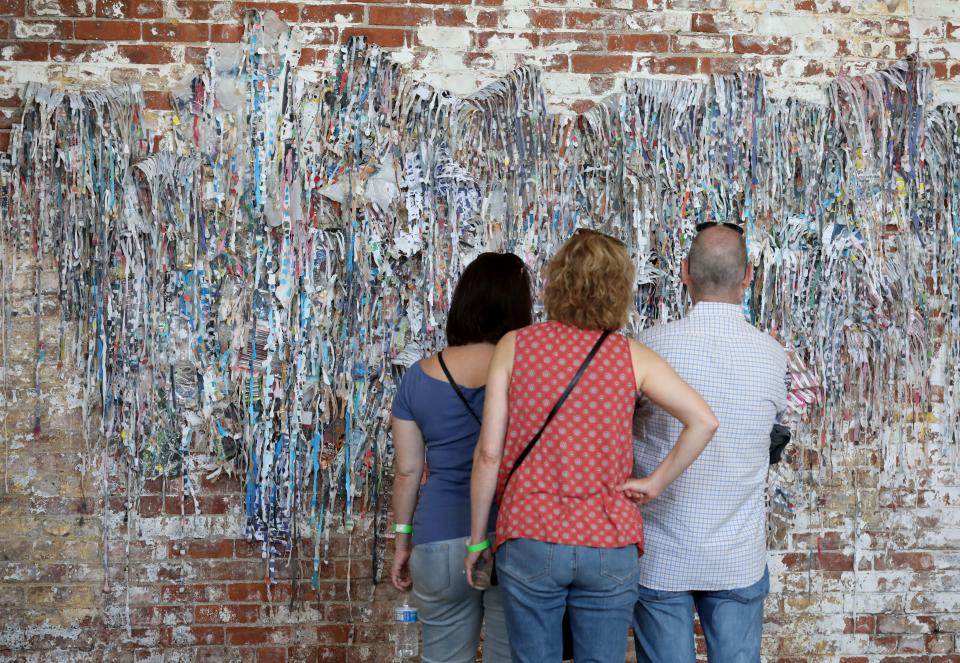 Visitors check out some art at the GARNER Arts Center in 2019. Garner Arts Festival takes place May 21, 22, 2022.