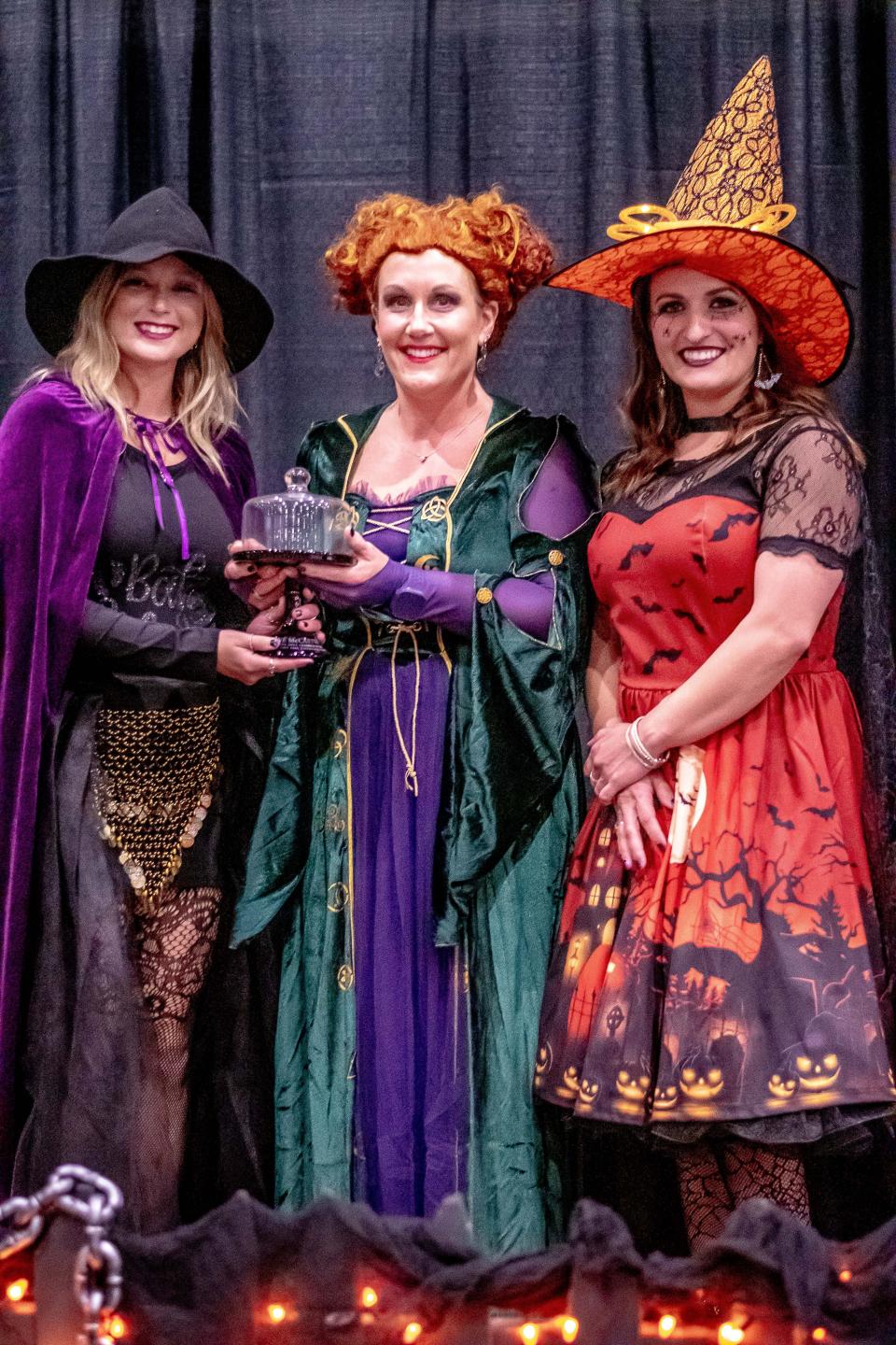 Lane McCartney (left) accepts her BREW Award for Emerging Leader from Chamber of Commerce President Jennifer Vincent (center) and the 2022 recipient, Ashley Davis.