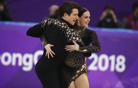 Figure Skating - Pyeongchang 2018 Winter Olympics - Ice Dance short dance competition - Gangneung Ice Arena - Gangneung, South Korea - February 19, 2018 - Tessa Virtue and Scott Moir of Canada perform. REUTERS/Phil Noble