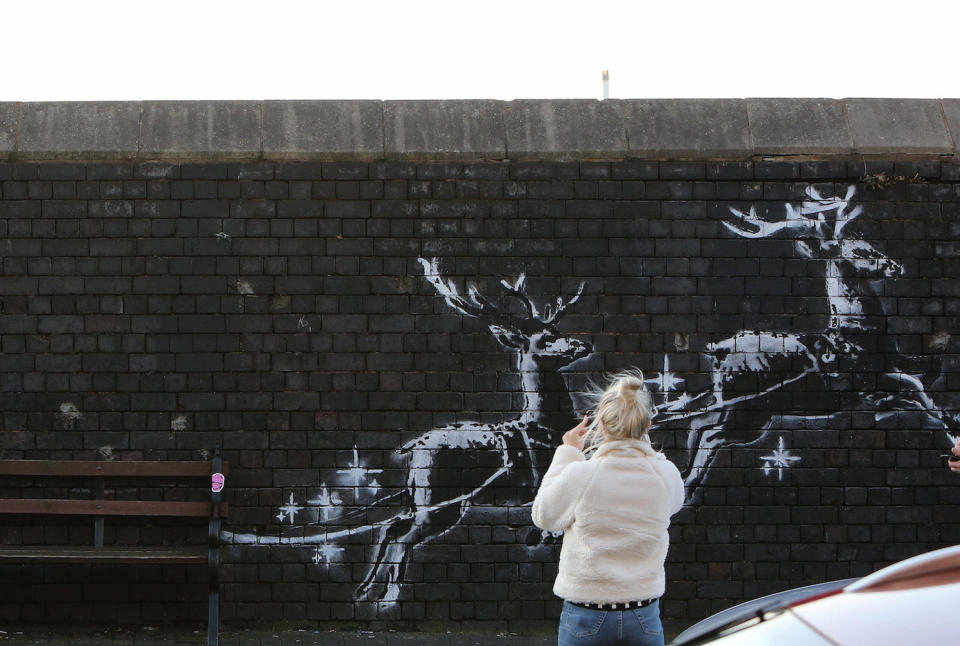 Crowds flocked to see the mural before it was defaced (Picture: SWNS)