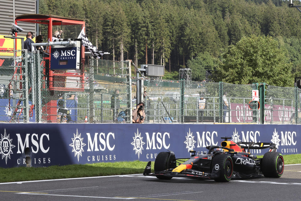 Red Bull driver Max Verstappen of the Netherlands receives the checkered flag as he crosses the finish line to win the sprint race ahead of the Formula One Grand Prix at the Spa-Francorchamps racetrack in Spa, Belgium, Saturday, July 29, 2023. The Belgian Formula One Grand Prix will take place on Sunday. (AP Photo/Geert Vanden Wijngaert)