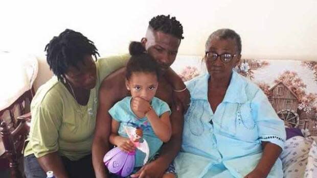 Most of Murray Hillocks's immediate family lives in a part of St. Vincent that's in the orange zone of risk to the volcanic eruption. Hillocks is pictured with his mother, left, daughter, front, and grandmother, right.
