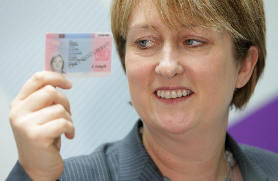 Jacqui Smith, the UK’s first female home secretary, pictured in 2008 holding an example of an identity card (Dominic Lipinski/PA) (PA Archive)