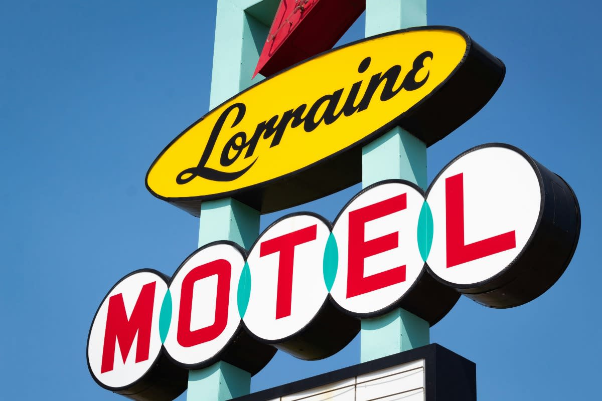 The Lorraine Motel was one of several safe spaces for Black travelers listed in the Negro Motorist Green Book in the 1960s. Pictured: Lorraine Motel Sign against a blue sky