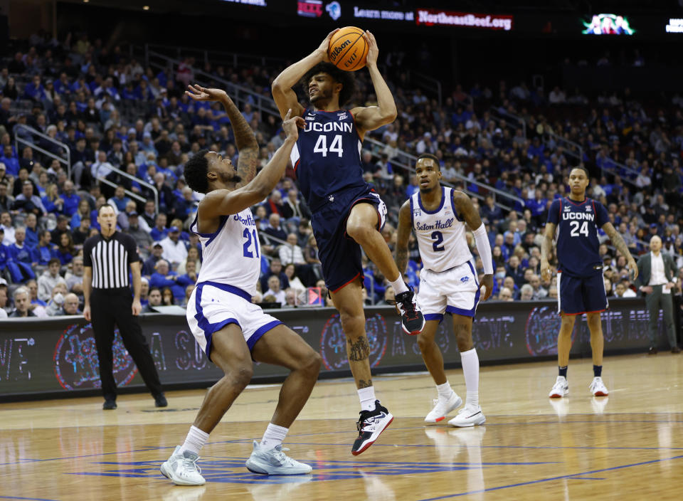 UConn guard Andre Jackson Jr. (44) shoots over Seton Hall guard Femi Odukale (21) during the first half of an NCAA college basketball game in Newark, N.J., Wednesday, Jan.18, 2023. (AP Photo/Noah K. Murray)