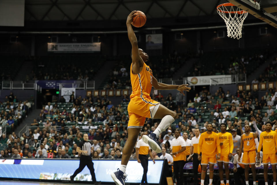 FILE - UTEP forward Bryson Williams (11) makes a slam dunk over Hawaii during the second half of an NCAA college basketball game in Honolulu, in this Sunday, Dec. 22, 2019, file photo. There are three super seniors making their Tech debuts: guards Davion Warren from Hampton and Adonis Arms from Winthrop, and forward Bryson Williams from UTEP. (AP Photo/Marco Garcia, File)