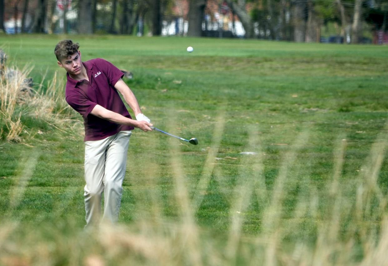 La Salle's Max Jackson hits out of the rough on the fourth hole during Monday's match.