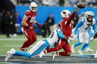 Arizona Cardinals quarterback Kyler Murray passes under pressure from Carolina Panthers defensive end Brian Burns during the second half of an NFL football game on Sunday, Oct. 2, 2022, in Charlotte, N.C. (AP Photo/Rusty Jones)