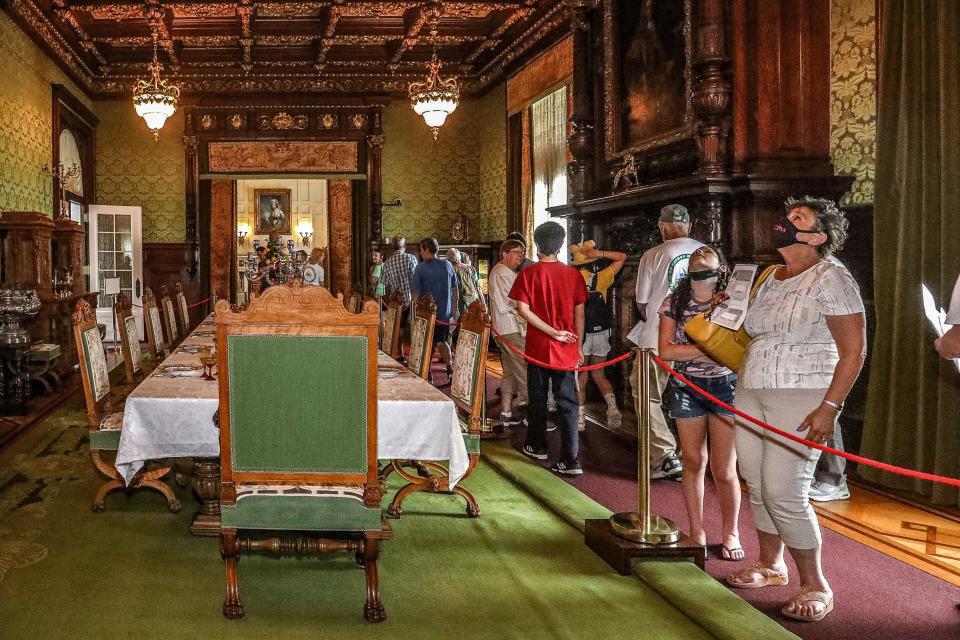 Visitors explore the Dining Room inside The Henry Morrison Flagler Museum in Palm Beach.