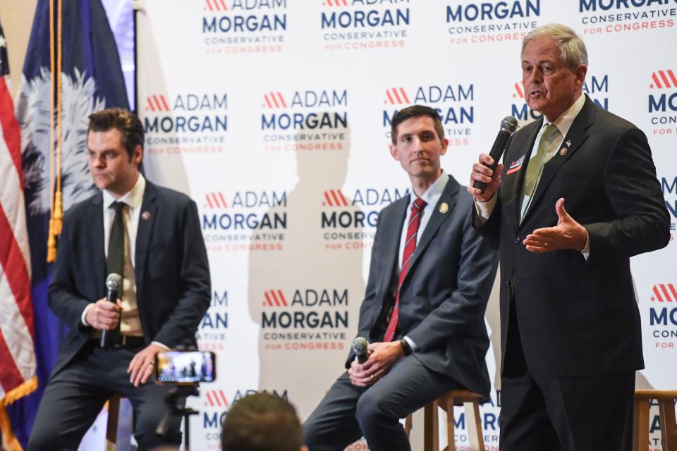 From left, U.S. Rep. Matt Gaetz, R-Fla., state Rep. Adam Morgan, and U.S. Rep. Ralph Norman, R-SC, speak on stage during a rally in support of Morgan's campaign against incumbent, William Timmons, at the Marriott in Greenville, S.C. on Tuesday, April 23, 2024.