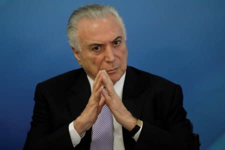 FILE PHOTO: Brazil's President Michel Temer gestures during a ceremony on a new National ID Card in Brasilia, Brazil, February 5, 2018. REUTERS/Ueslei Marcelino